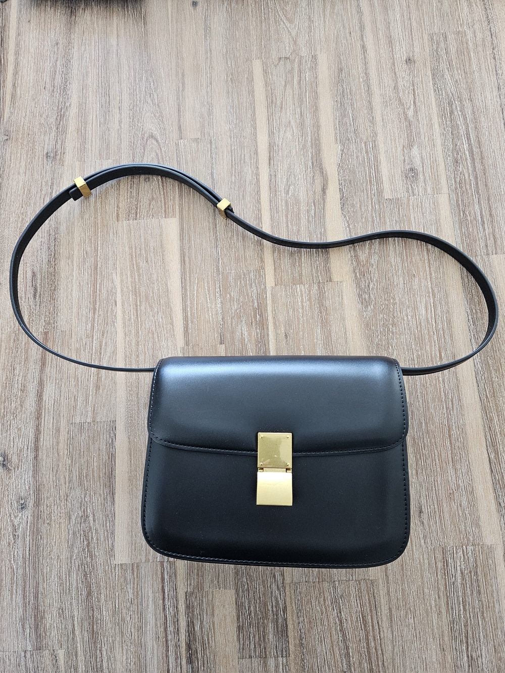 Sleek Minimalist Black Faux Leather Shoulder Bag with Gold Hardware